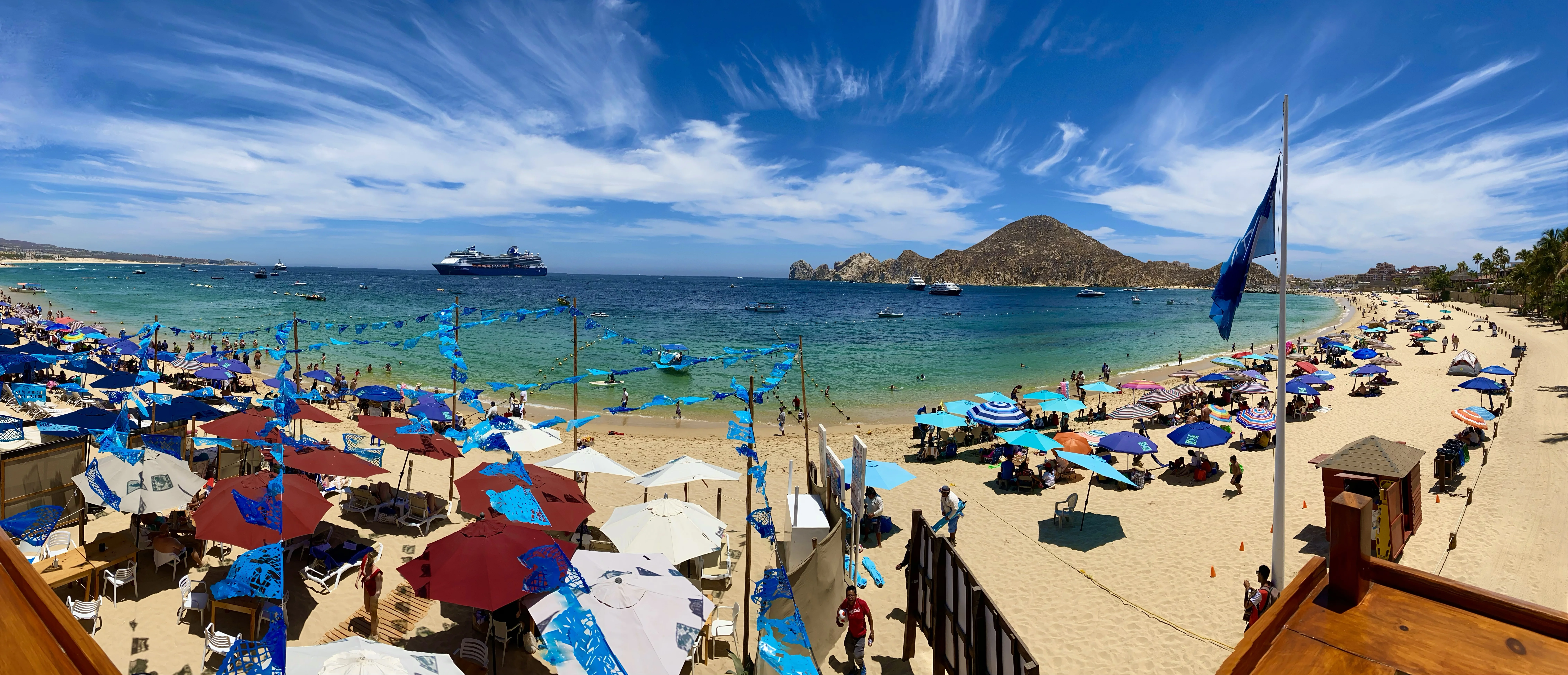 Hungry Shark bar with the Arch of Cabo San Lucas in the background