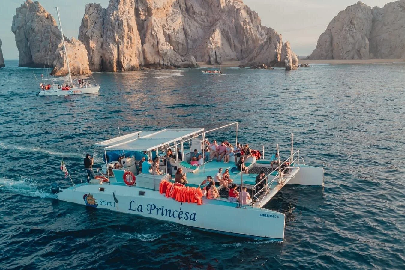 La Princesa catamaran sailing past El Arco at sunset, Cabo San Lucas