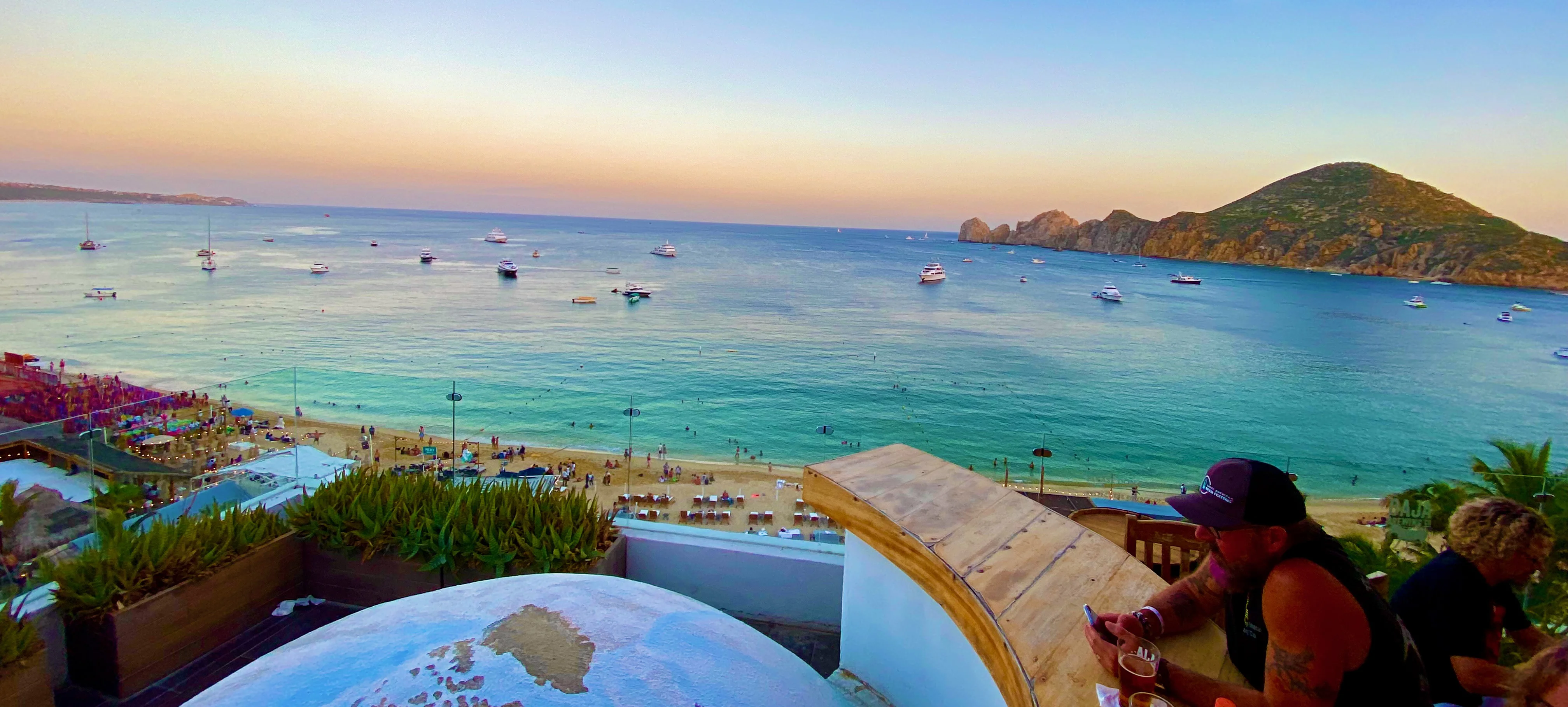 Baja Brewing Company rooftop at sunset — Médano Beach panorama